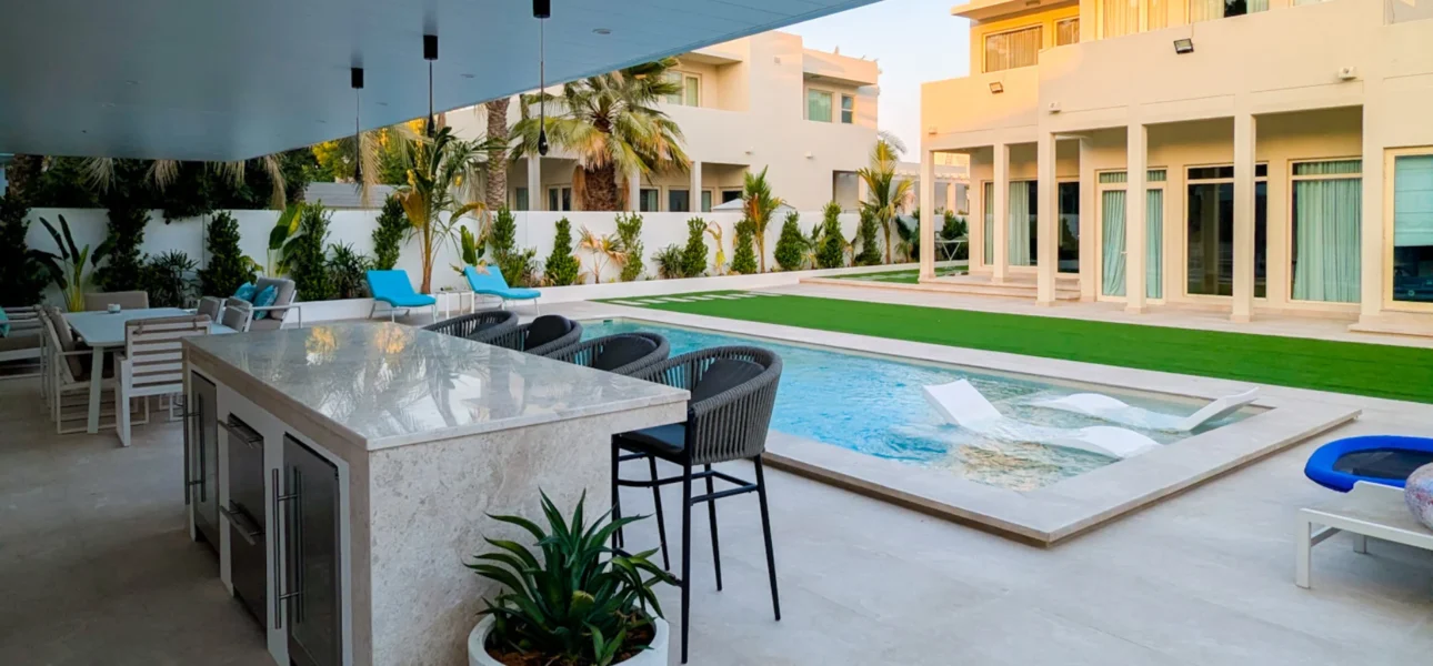 Luxury swimming pool construction with outdoor sunken bar and modern pergola by BBH Builds.